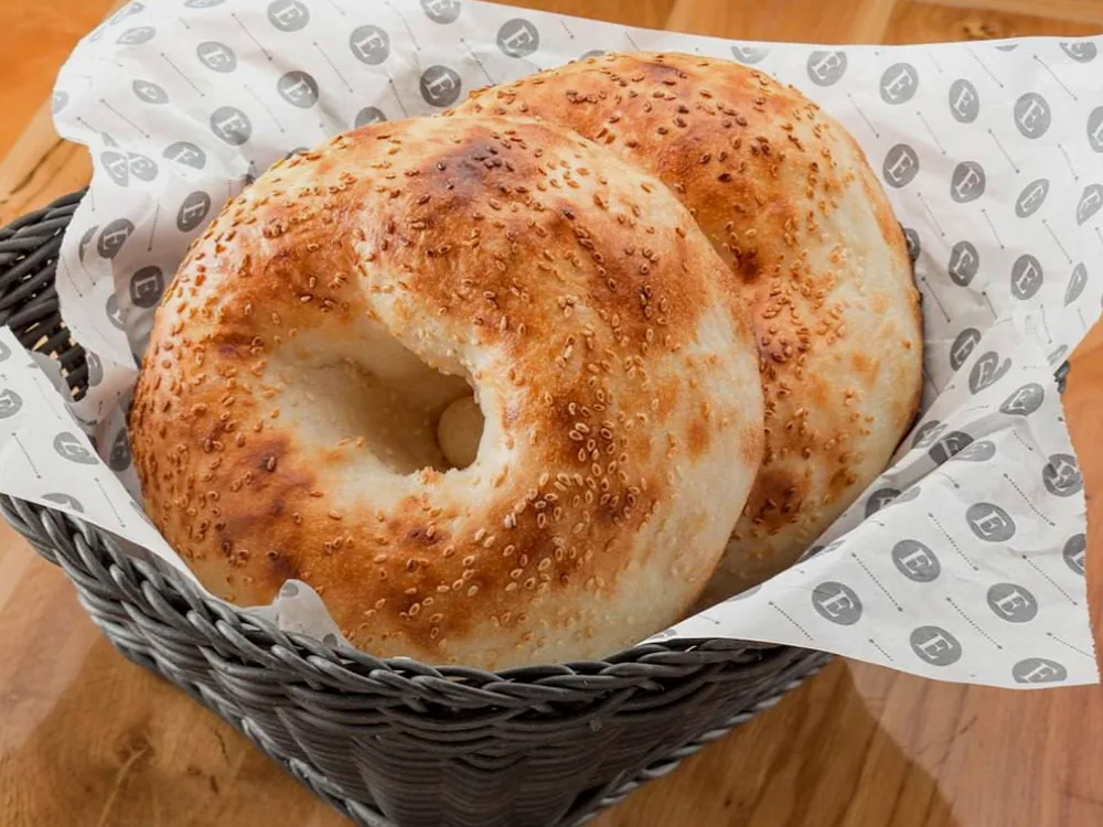 A basket of freshly baked round flatbreads