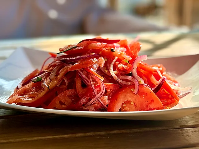 Achichuk — thinly sliced tomato and onion salad