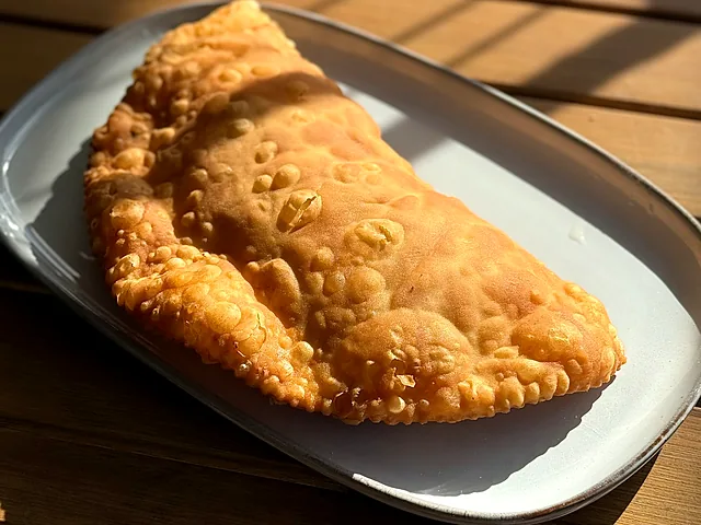 Cheburek — a crisp fried pastry filled with seasoned meat