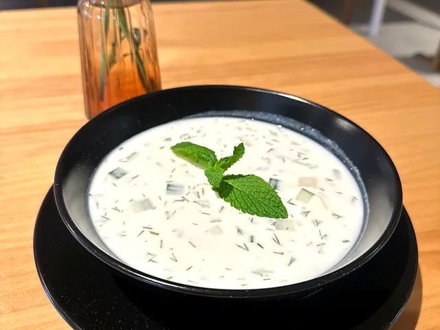 Okroshka, a cold soup with cucumber and fresh herbs